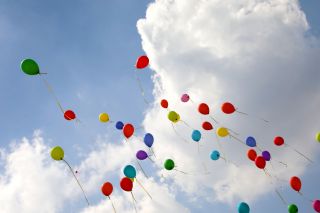 balloons fly high in the sky